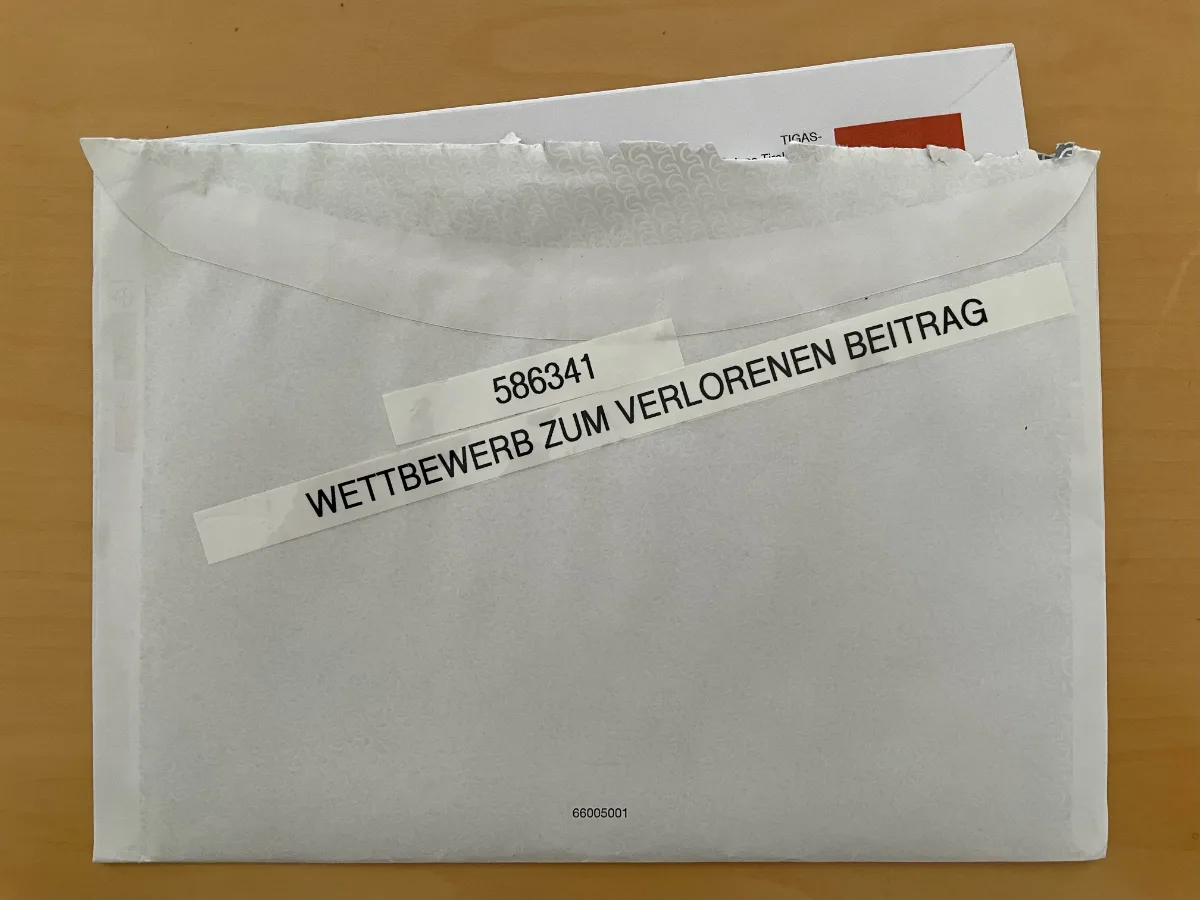 Umschlag mit Aufschrift Wettbewerb zum verlorenen Beitrag